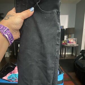 Size 00 American Eagle black jeans heavily distressed